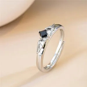 Gothic black gemstone wing open ring, adjustable silver metal fashion finger jewelry detail.