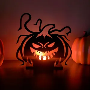 Dettaglio ornamento zucca luminosa in legno di Halloween, decorazione da tavola.