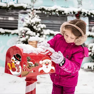 Christmas magnetic reflective sticker detail showing cute snowman and Santa on red mailbox outdoors.
