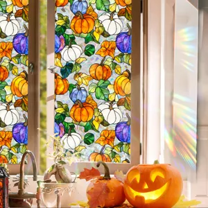 Halloween window film scene showing colorful stained glass pumpkin pattern and rainbow light effect.