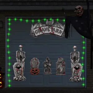 Halloween garage decoration set with skeletons tombstones and green lights for spooky party.