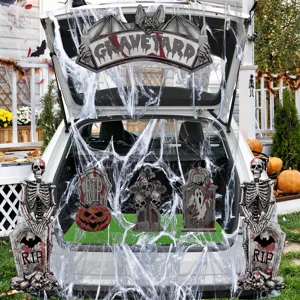 Halloween car trunk decoration set with skeletons tombstones and spider webs for spooky party.