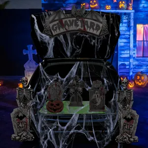 Halloween car trunk decoration set with skeletons tombstones and fake spider webs for display.