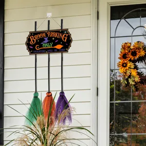 Halloween wooden hanging sign detail, witch broom decor for outdoor door decoration.