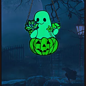 Detailed view of glowing Halloween ghost acrylic hanging ornament with spooky night backdrop.