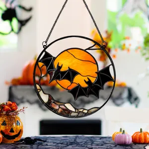 Detail shot of the Halloween metal hanging bat decor, showcasing intricate stained glass.
