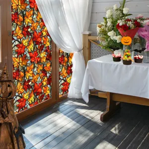 Stained glass autumn maple leaf window film applied on glass door for holiday home decoration.