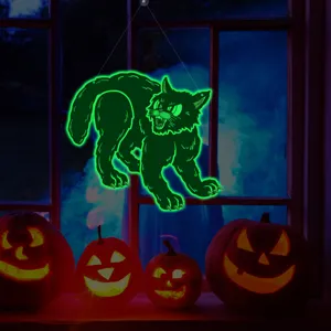 Detailed view of glowing black cat Halloween window hanging decoration with festive pumpkin scene.
