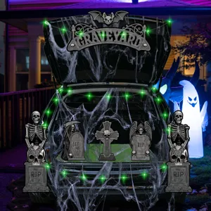 Halloween trunk or treat car decorations kit with skeletons tombstones and spider web lights.