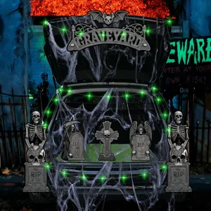 Halloween car trunk decoration set with skeletons, tombstones, and spider web for party.