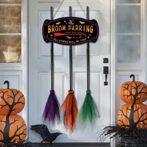 Halloween wooden witch broom hanging sign with colorful bristles for holiday door decor detail.