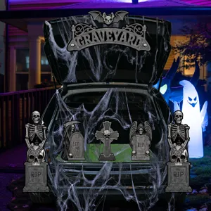 Halloween car trunk decoration set with skeleton tombstones and spider webs for spooky party.