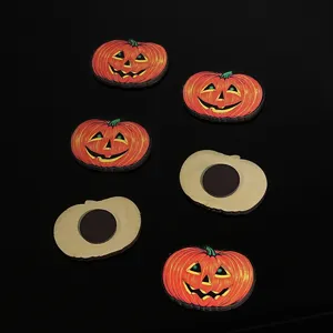 Wooden Halloween pumpkin fridge magnet detail view showing front design and back magnetic base.