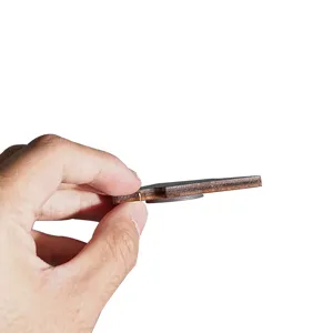 Detailed side view of wooden fridge magnet showing layer thickness and back magnet.