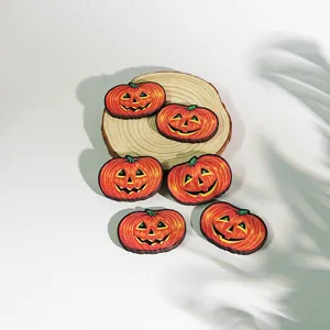 Detailed view of wooden Halloween pumpkin magnetic fridge stickers for festive kitchen decor.