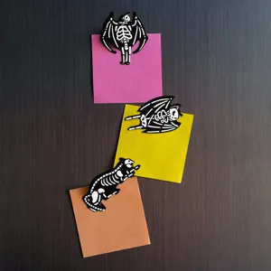 Halloween wooden magnetic fridge sticker detail, spooky cat skeleton design for kitchen decor.