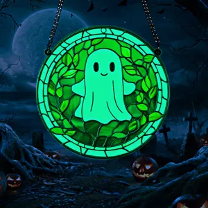 Halloween glowing acrylic ghost hanging decoration detail showing vibrant green night light effect.