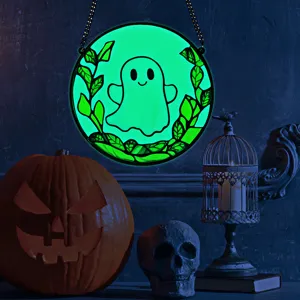 Detailed view of Halloween glowing acrylic ghost hanging decoration with scenic props.