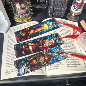 Christmas transparent acrylic bookmark with tassel, stained glass design detail view.