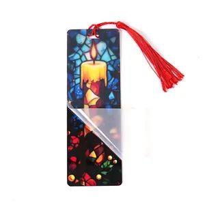 Close-up detail of the transparent acrylic bookmark featuring vibrant stained glass candle art design.