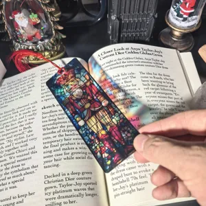 Christmas transparent acrylic bookmark with nutcracker stained glass design and tassel.
