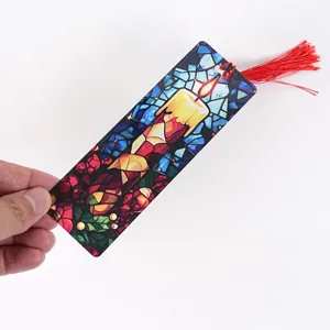 Christmas transparent acrylic bookmark with stained glass candle pattern and red tassel.