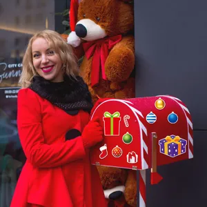 Detailed view of Christmas magnetic stickers on mailbox showing colorful festive holiday designs.