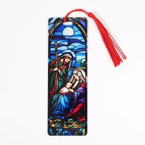 Stained glass style Nativity scene acrylic bookmark detail with vibrant red tassel.
