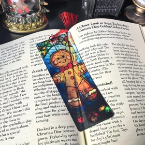 Clear acrylic gingerbread man bookmark with red tassel for Christmas stationery reading lover gifts.