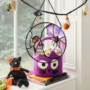 Detailed view of Halloween metal hanging decor featuring a skull and spider web design for party.