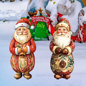 Close-up detail of vintage Christmas Santa garden stakes glowing yard decor for holiday.
