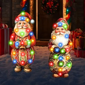 Illuminated Christmas Santa garden stakes with colorful LED lights, perfect outdoor holiday yard decorations.
