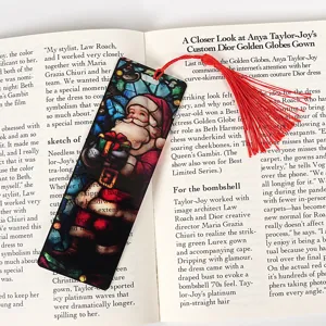 Christmas transparent acrylic bookmark with red tassel, festive holiday stationery craft detail.