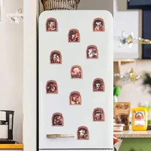 Wooden Christmas mouse hole fridge magnet detail showing 3D arched frame design on white fridge.