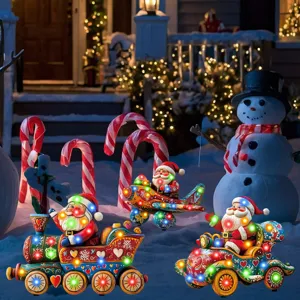 Christmas garden decorative yard light stake details showing colorful glowing Santa train.