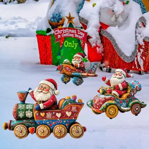 Detailed view of colorful Christmas Santa yard stakes featuring train and car design in snow.