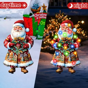 Christmas Santa Claus garden stake yard light, glowing outdoor holiday decoration for yard.