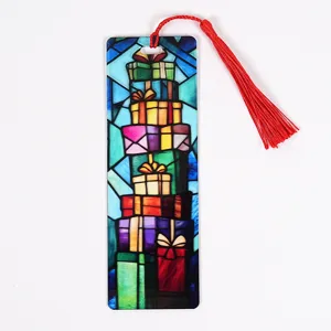 Detailed view of the Christmas stained glass acrylic bookmark with a vibrant red tassel.