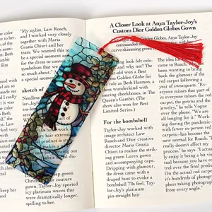 Transparent acrylic Christmas bookmark with red tassel, festive snowman design for reading books.