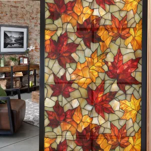 Detail view of stained glass autumn maple leaves window film on glass door in room.