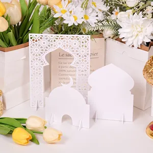 Islamic architecture tabletop ornament detail view, white mosque and arch decor for Ramadan.