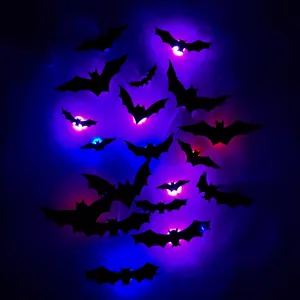 3D Halloween bat wall stickers with glowing LED lights, perfect for festive party room decor.