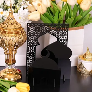 Detailed view of black acrylic Islamic mosque desktop ornament with ornate arches and domes.