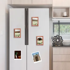 Islamic architectural fridge magnets featuring wooden frames and sacred scenery for home decor.