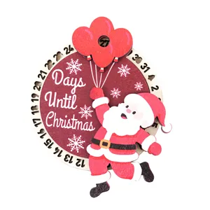 Detalle de imán de calendario de cuenta regresiva de Navidad en madera con Papá Noel y copo.