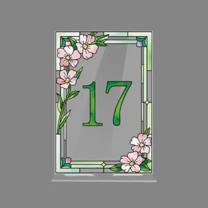 Acrylic table number sign detail view, stained glass floral border design showing number 17.