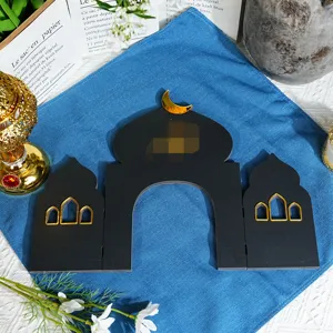 Middle Eastern style mosque tabletop decoration with gold crescent and window for festival decor.