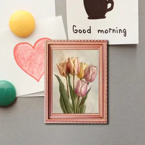 Detailed shot of vintage style wooden photo frame fridge magnet with tulip painting.