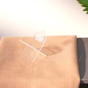 Clear acrylic date holder mini Quran stand with Islamic arch shape and Arabic script.