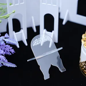 Clear acrylic book stand detail featuring elegant Arabic calligraphy, perfect for desktop decor.
